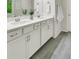 Bathroom featuring double sinks, stylish cabinets, and tile flooring at 4240 Spring Ridge Dr, Cumming, GA 30028