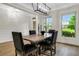 Contemporary dining room with stylish lighting and neutral decor, illuminated by natural light at 4240 Spring Ridge Dr, Cumming, GA 30028