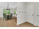 Entryway with hardwood floors, coat hooks, and a view to the dining area at 4240 Spring Ridge Dr, Cumming, GA 30028
