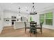 Open kitchen and dining area featuring a modern design and hardwood floors at 4240 Spring Ridge Dr, Cumming, GA 30028