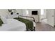 Spacious main bedroom with tv and an ensuite bathroom and walk-in closet at 4240 Spring Ridge Dr, Cumming, GA 30028