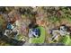 Stunning aerial view of estate home on a wooded lot with mature trees and an in-ground pool at 4370 Freys Farm Nw Ln, Kennesaw, GA 30152