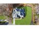 Overhead shot of luxury home with well-maintained lawn and landscaping, showcasing architectural detail at 4370 Freys Farm Nw Ln, Kennesaw, GA 30152