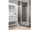 Modern bathroom with a glass-enclosed shower, a white vanity, and tile flooring at 4370 Freys Farm Nw Ln, Kennesaw, GA 30152