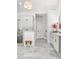 Bathroom featuring a glass-enclosed shower, dual sinks and gray cabinets at 4370 Freys Farm Nw Ln, Kennesaw, GA 30152