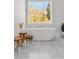 Freestanding tub next to a large window offering relaxing views at 4370 Freys Farm Nw Ln, Kennesaw, GA 30152