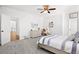 Bedroom featuring neutral walls, carpet, and a full size bed with a ceiling fan above at 4370 Freys Farm Nw Ln, Kennesaw, GA 30152