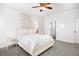 Bright bedroom features white walls, carpet, and a queen size bed at 4370 Freys Farm Nw Ln, Kennesaw, GA 30152