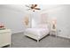 Bedroom featuring neutral walls, a ceiling fan, carpet, and a full size bed with decor at 4370 Freys Farm Nw Ln, Kennesaw, GA 30152