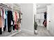 Walk-in closet showing built-in shelving and hanging racks for optimal storage and organization at 4370 Freys Farm Nw Ln, Kennesaw, GA 30152