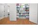 View of the open closet showing its storage capacity with shelves and room for hanging clothes at 4370 Freys Farm Nw Ln, Kennesaw, GA 30152