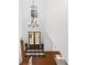 Airy two-story foyer with hardwood floors, a chandelier, and double doors leading to the outside at 4370 Freys Farm Nw Ln, Kennesaw, GA 30152