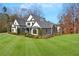 Charming two-story home with a sprawling green lawn, manicured landscaping and neutral paint at 4370 Freys Farm Nw Ln, Kennesaw, GA 30152