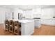 Spacious kitchen with a large island, stainless steel appliances, and pendant lighting at 4370 Freys Farm Nw Ln, Kennesaw, GA 30152
