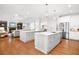 Bright kitchen with double islands, stainless steel appliances, and seamless open-concept layout to adjacent spaces at 4370 Freys Farm Nw Ln, Kennesaw, GA 30152