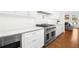 Modern kitchen featuring stainless steel appliances, white cabinetry, and a professional grade cooktop at 4370 Freys Farm Nw Ln, Kennesaw, GA 30152