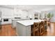 Open kitchen with a large island, stainless steel appliances, and a view into the adjacent dining area at 4370 Freys Farm Nw Ln, Kennesaw, GA 30152