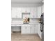 Modern kitchen with white cabinets, subway tile backsplash and desk area at 4370 Freys Farm Nw Ln, Kennesaw, GA 30152