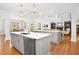 Beautiful open kitchen with a double islands, stainless steel appliances, and adjacent living space at 4370 Freys Farm Nw Ln, Kennesaw, GA 30152
