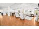 Spacious living room with hardwood floors, coffered ceilings, and natural light, perfect for relaxation and entertaining at 4370 Freys Farm Nw Ln, Kennesaw, GA 30152