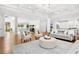 Open-concept living area featuring hardwood floors and a seamless transition to kitchen at 4370 Freys Farm Nw Ln, Kennesaw, GA 30152