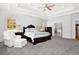 Elegant main bedroom with a tray ceiling, large windows, and access to the bathroom at 4370 Freys Farm Nw Ln, Kennesaw, GA 30152