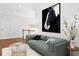 This sitting area features a horse art piece with hardwood floors and a view of the stairwell at 4370 Freys Farm Nw Ln, Kennesaw, GA 30152