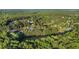A picturesque aerial view shows mature trees surrounding homes in the area at 4614 Riveredge Cv, Snellville, GA 30039