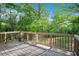 A spacious wooden deck looks out to a private and picturesque wooded area at 4614 Riveredge Cv, Snellville, GA 30039