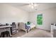 Cozy bedroom has a bed, a desk and a window with view of greenery at 4614 Riveredge Cv, Snellville, GA 30039
