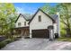Beautiful two-story home with a spacious driveway, attached garage, and inviting front porch at 4614 Riveredge Cv, Snellville, GA 30039