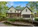 Charming two-story home with a welcoming front porch and well-maintained landscaping at 4614 Riveredge Cv, Snellville, GA 30039