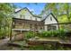 A charming two-story home with a front porch is beautifully landscaped at 4614 Riveredge Cv, Snellville, GA 30039