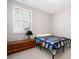 Bright bedroom featuring a window with white shutters, providing natural light and privacy at 503 Forest Ln, Canton, GA 30114
