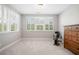 Bright bedroom with large windows, shutter blinds and neutral decor, offering a serene space at 503 Forest Ln, Canton, GA 30114