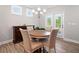 Cozy dining room with a round table and natural lighting at 503 Forest Ln, Canton, GA 30114