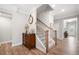 Inviting entryway showcasing wood floors, staircase, and elegant decor create a warm and welcoming ambiance at 503 Forest Ln, Canton, GA 30114