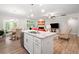 Open concept kitchen featuring an island, stainless steel appliances, and seamless flow to the living spaces at 503 Forest Ln, Canton, GA 30114