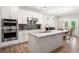 Modern kitchen with an island, stainless steel appliances, and a breakfast nook at 503 Forest Ln, Canton, GA 30114
