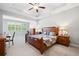 Spacious main bedroom with a tray ceiling and natural light at 503 Forest Ln, Canton, GA 30114