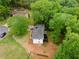 Aerial shot of the home set amid lush landscaping and mature trees at 6659 Manoleta Dr, Lithonia, GA 30038