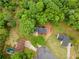 Overhead view of the home surrounded by lush greenery in a well-maintained community at 6659 Manoleta Dr, Lithonia, GA 30038
