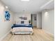 Basement bedroom boasts recessed lighting and minimalist artwork over a comfortable bed at 6659 Manoleta Dr, Lithonia, GA 30038