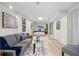 Open basement space with a comfortable seating area that leads to a cozy bedroom at 6659 Manoleta Dr, Lithonia, GA 30038