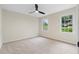 Light-filled bedroom with neutral carpet and large windows offers a comfortable retreat at 6659 Manoleta Dr, Lithonia, GA 30038