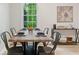 Eat-in dining area features a wood table, metal chairs, and a bright window at 6659 Manoleta Dr, Lithonia, GA 30038