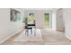 Modern home office with desk and decor and a view from two windows at 6659 Manoleta Dr, Lithonia, GA 30038