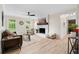 Spacious living room features a charming fireplace, cozy seating, and ample natural light at 6659 Manoleta Dr, Lithonia, GA 30038