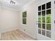 Sunroom with outdoor access to backyard deck features bead board paneling at 6659 Manoleta Dr, Lithonia, GA 30038