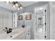 Bright bathroom featuring a clean vanity with modern fixtures and ample storage, providing a functional space at 1555 Heritage Trl, Roswell, GA 30075